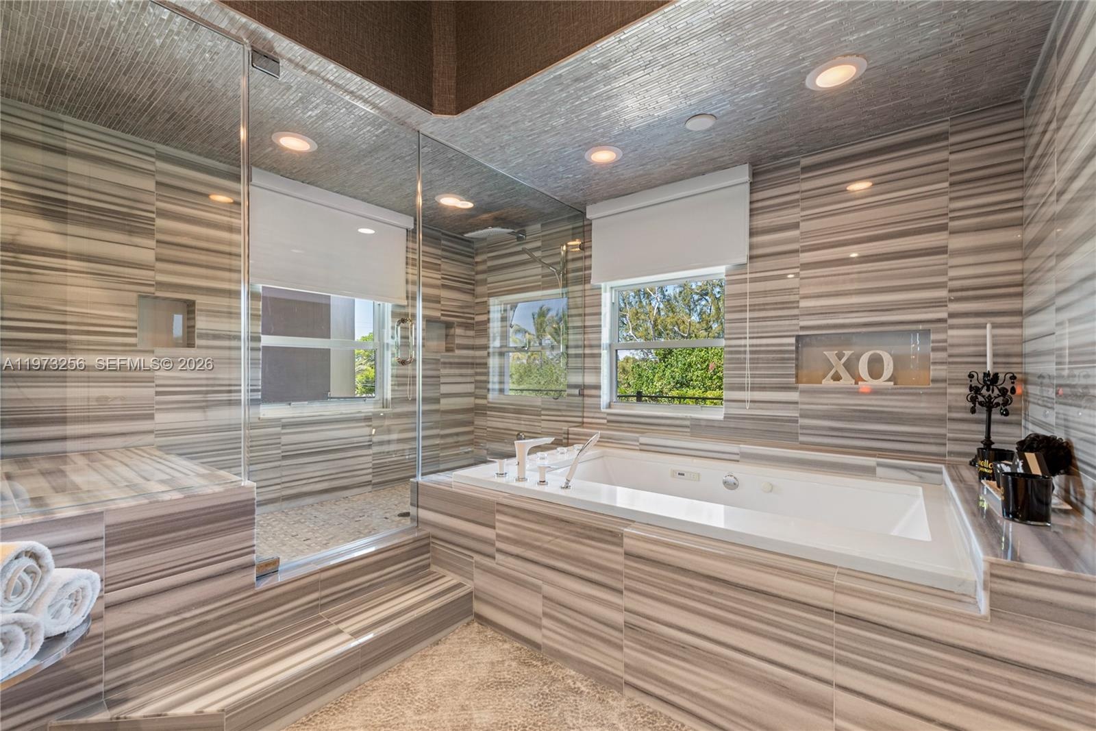 Grand living space with soaring ceilings and walls of glass